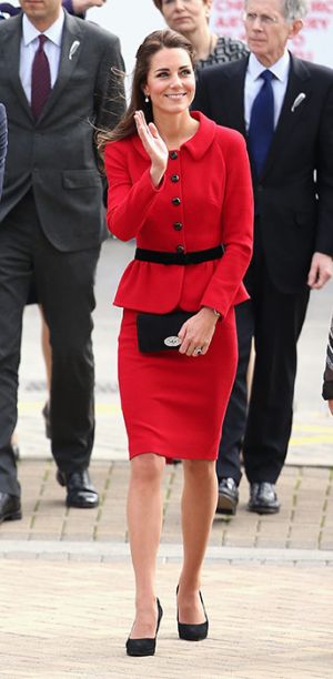 Kate Middleton - red Luisa Spagnoli suit cinched in at the waist by a black belt.jpg